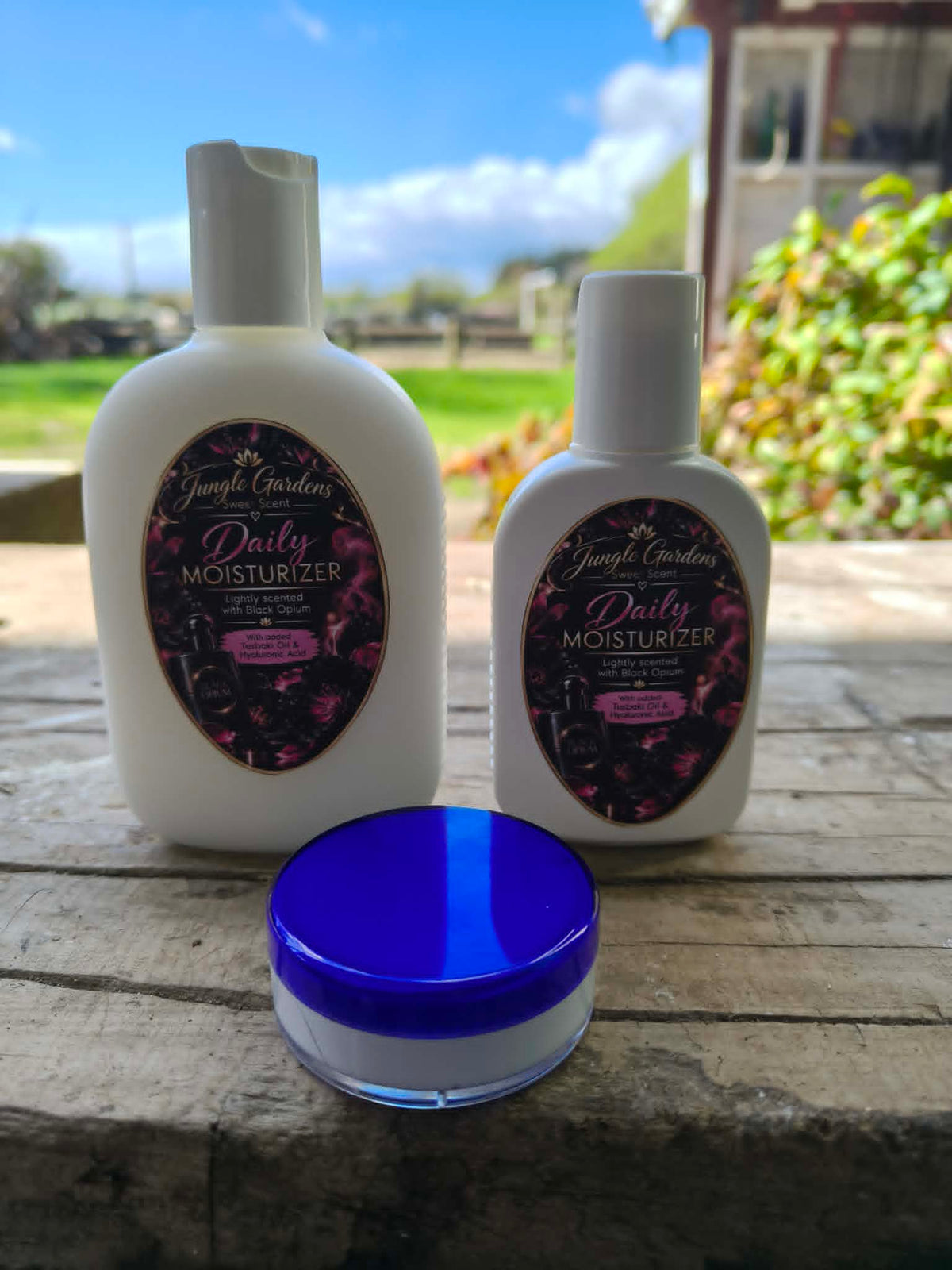 Black Opium moisturiser bottles and cream jar