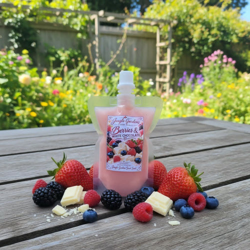 Berries & White Chocolate Wax Melt pouch surrounded by fresh berries and white chocolate pieces