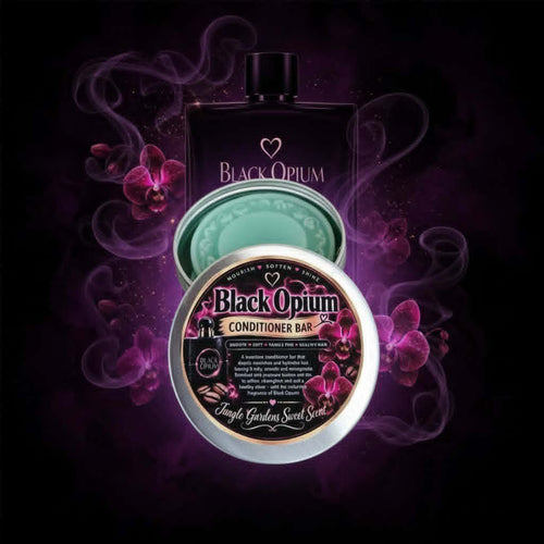Black Opium Conditioner Bar by Jungle Gardens Sweet Scent, shown in a silver tin with a teal conditioner bar, surrounded by orchids and moody purple smoke